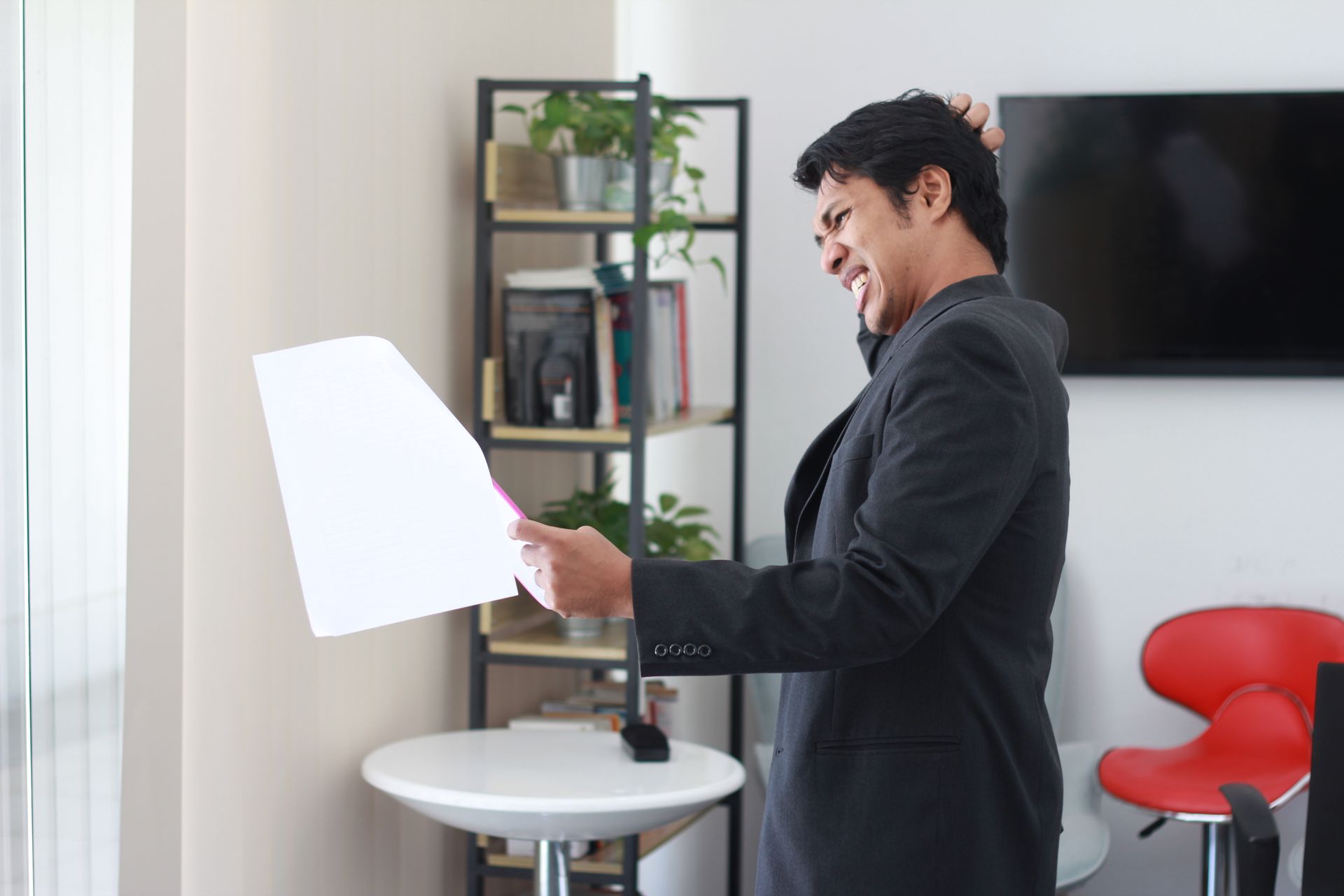 Overwhelmed business owner buried in work